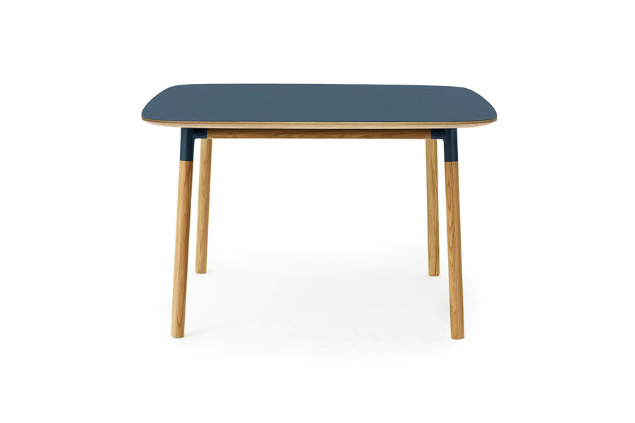 Form Table by Normann Copenhagen, showing front view of form table in square/blue linoleum.