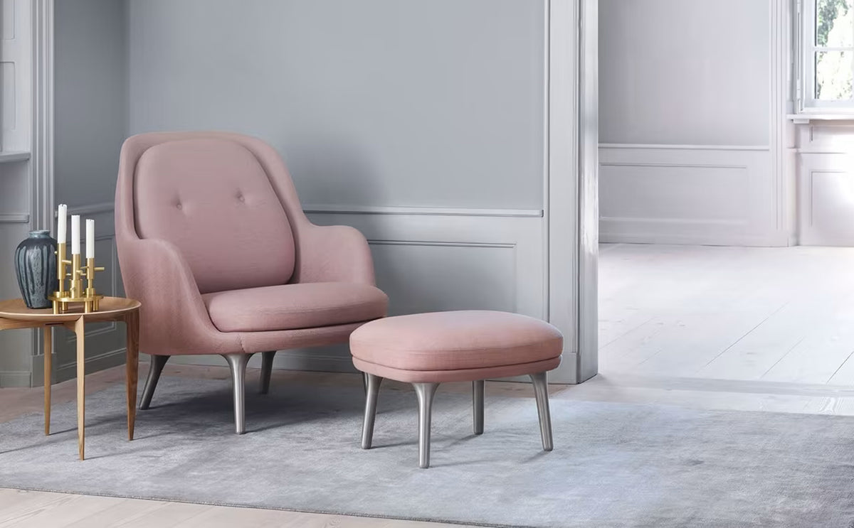 Fri Footstool by Fritz Hansen, showing fri footstool in live shot.