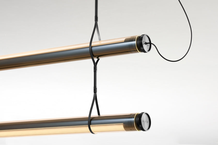 Fris Pro Pendant Light by Marset, showing closeup view of fris pro pendant lights in studio shot.
