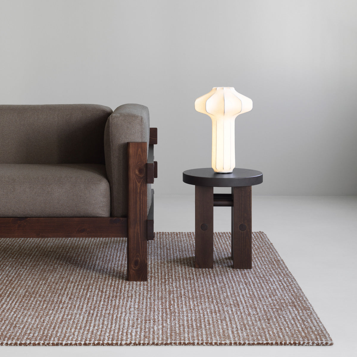 Fyr Stool by Normann Copenhagen, showing fyr stool in live shot.