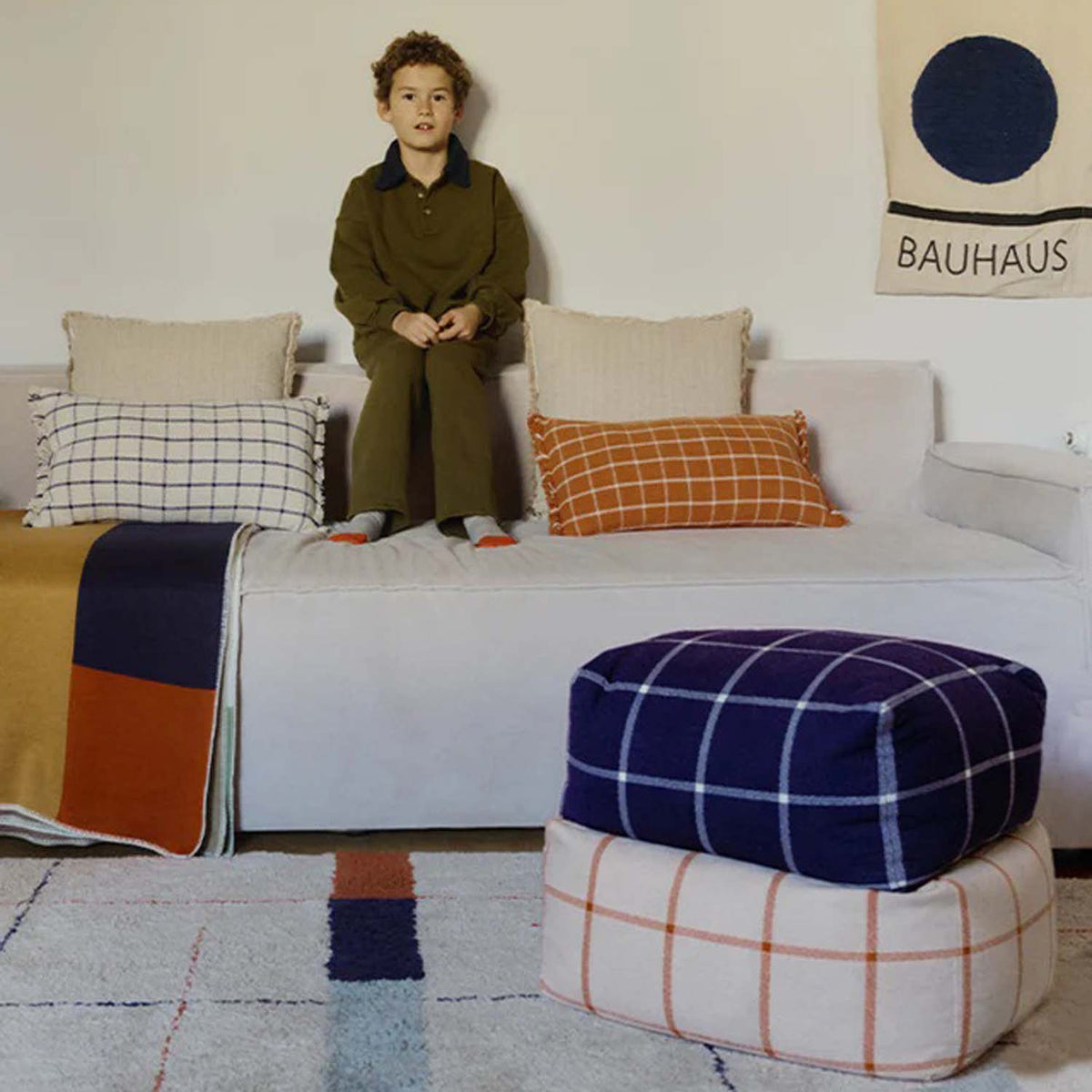 Geo Block Pouf by Lorena Canals, showing geo block pouf in live shot.
