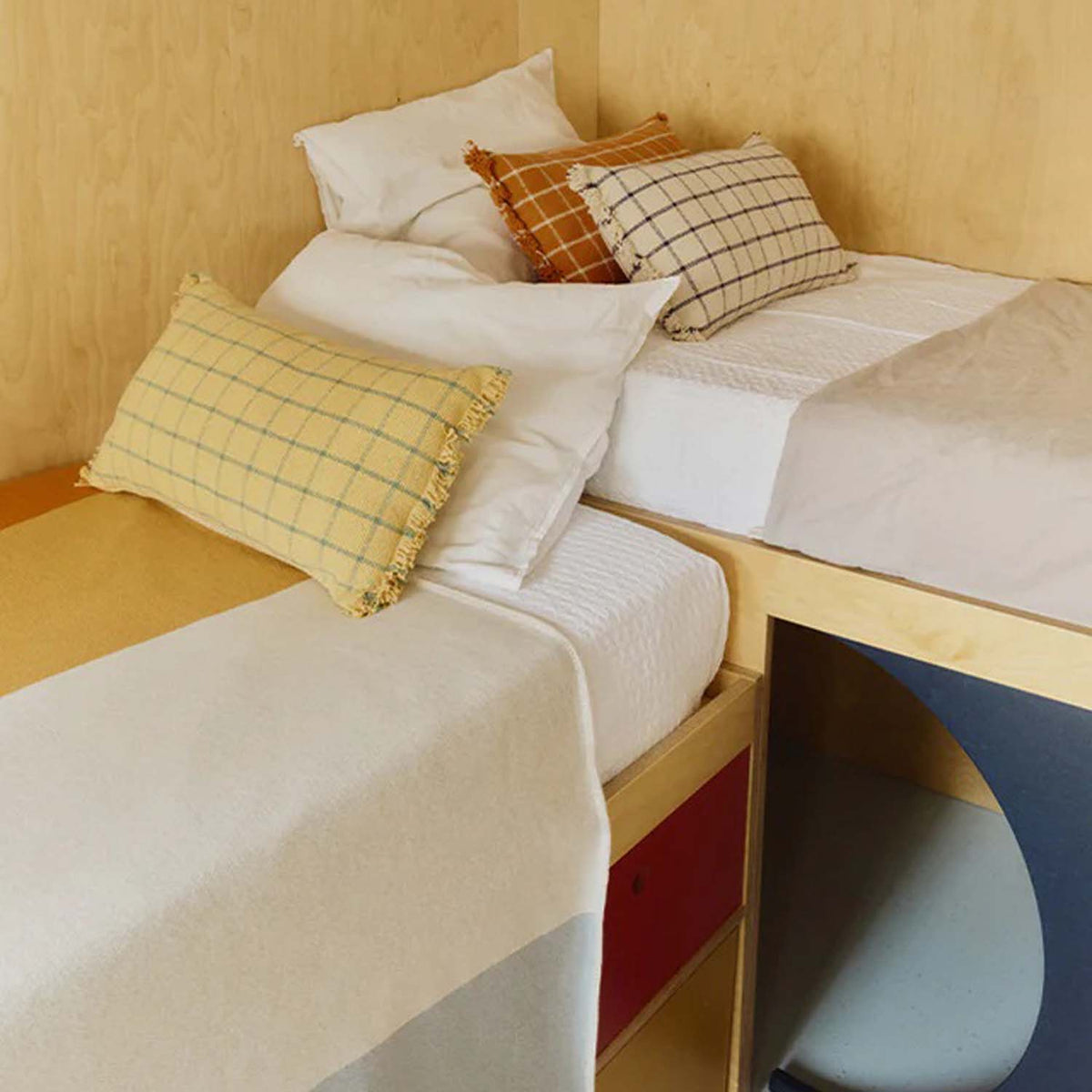 Geo Block Cushion by Lorena Canals, showing geo block cushion in live shot.