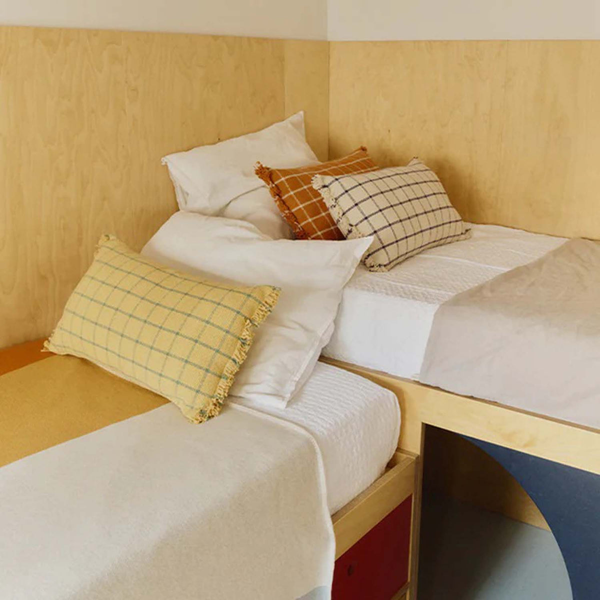 Geo Block Cushion by Lorena Canals, showing geo block cushion in live shot.