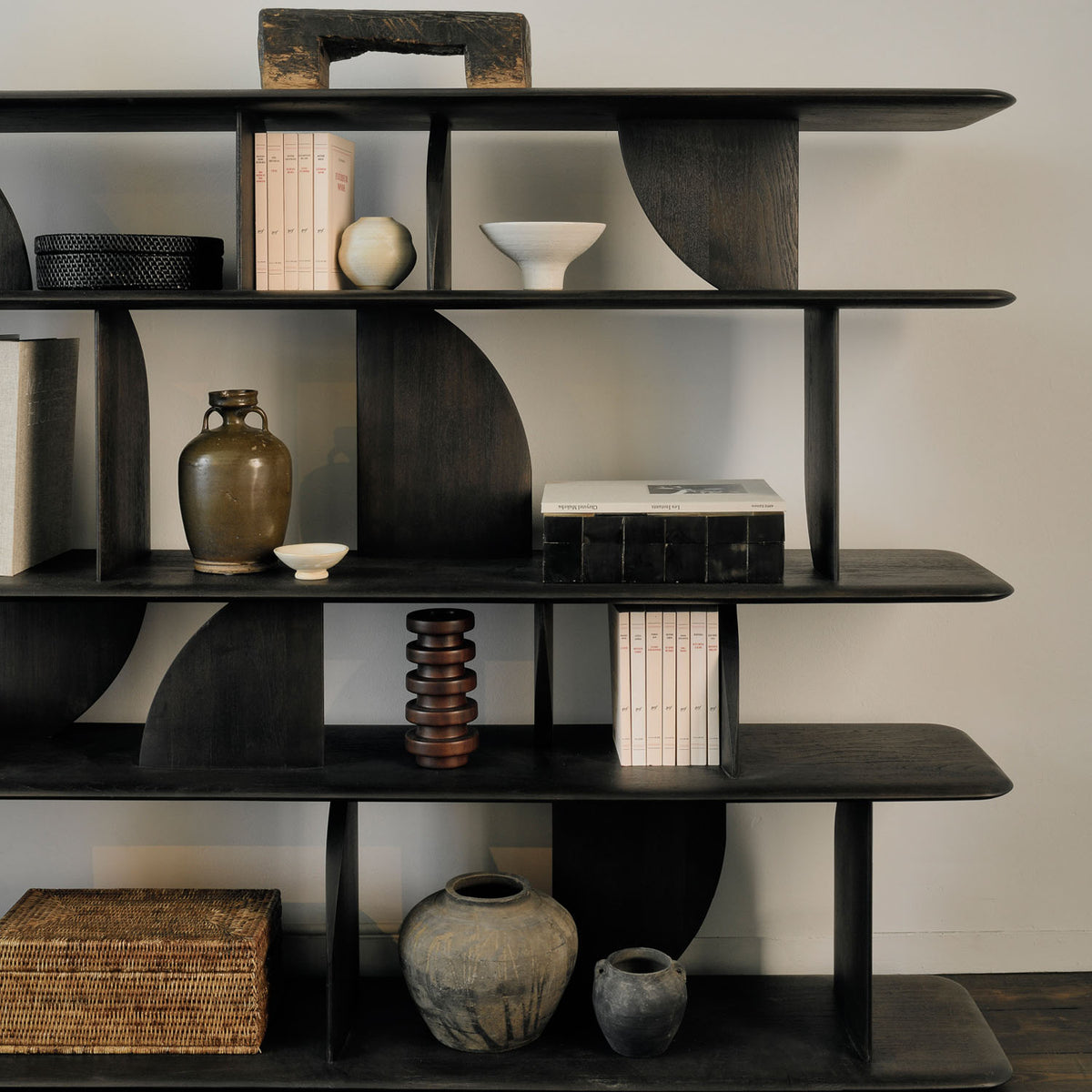 Geometric Rack Dark Teak by Ethnicraft, showing closeup view of geometric rack dark teak in live shot.