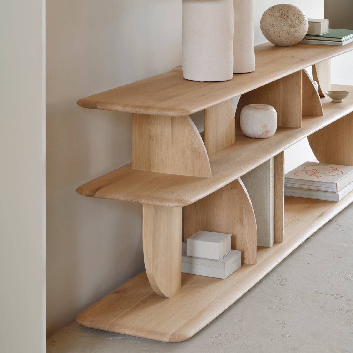 Geometric Sofa Console by Ethnicraft, showing closeup view of geometric sofa console in live shot.