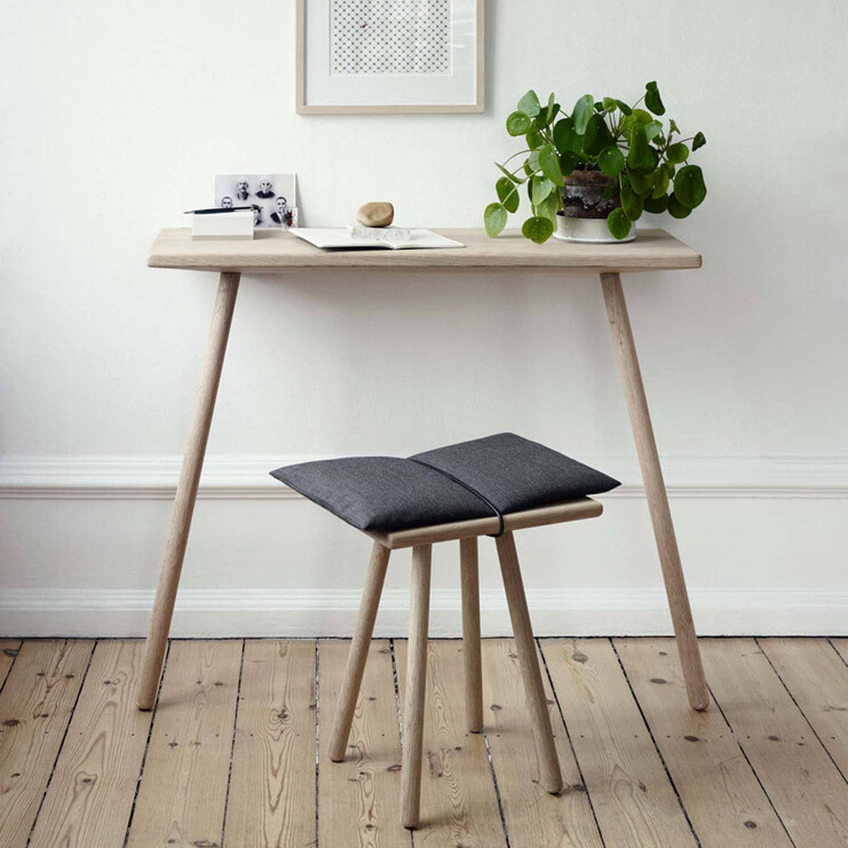 Georg Wall Desk by Fritz Hansen, showing georg wall desk in live shot.