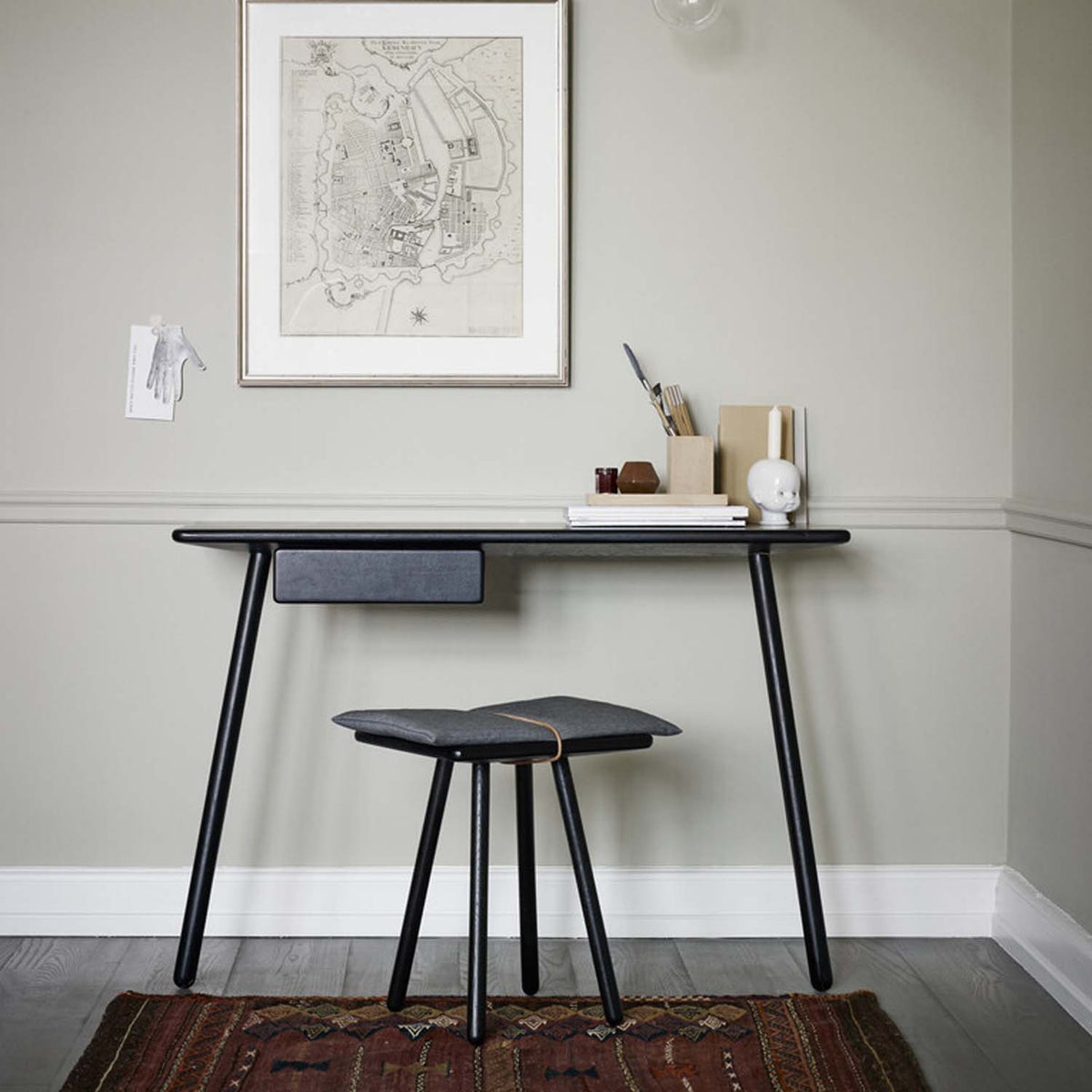 Georg Wall Desk by Fritz Hansen, showing georg wall desk in live shot.