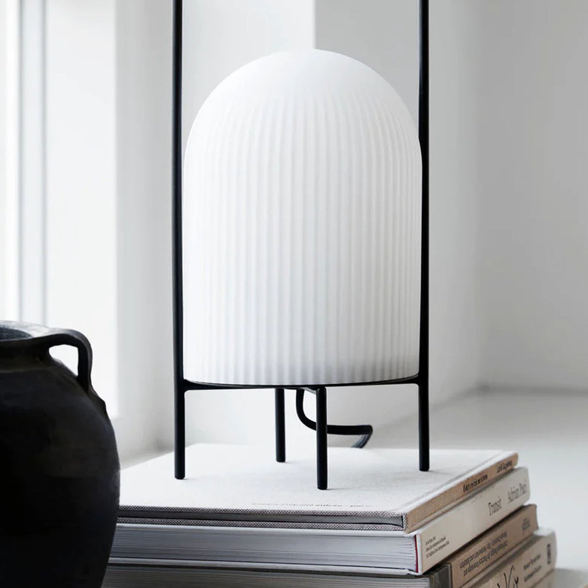 Ghost Table Lamp by Woud, showing ghost table lamp in live shot.