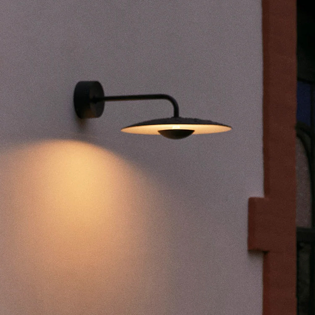 Ginger IP65 Outdoor Wall Light by Marset, showing ginger ip65 outdoor wall light in live shot. 