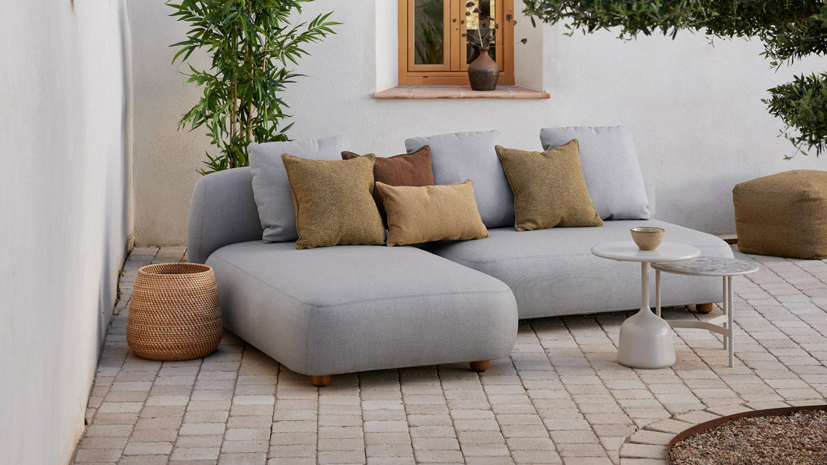 Glaze Coffee Table by Cane-Line, showing glaze coffee table in live shot.