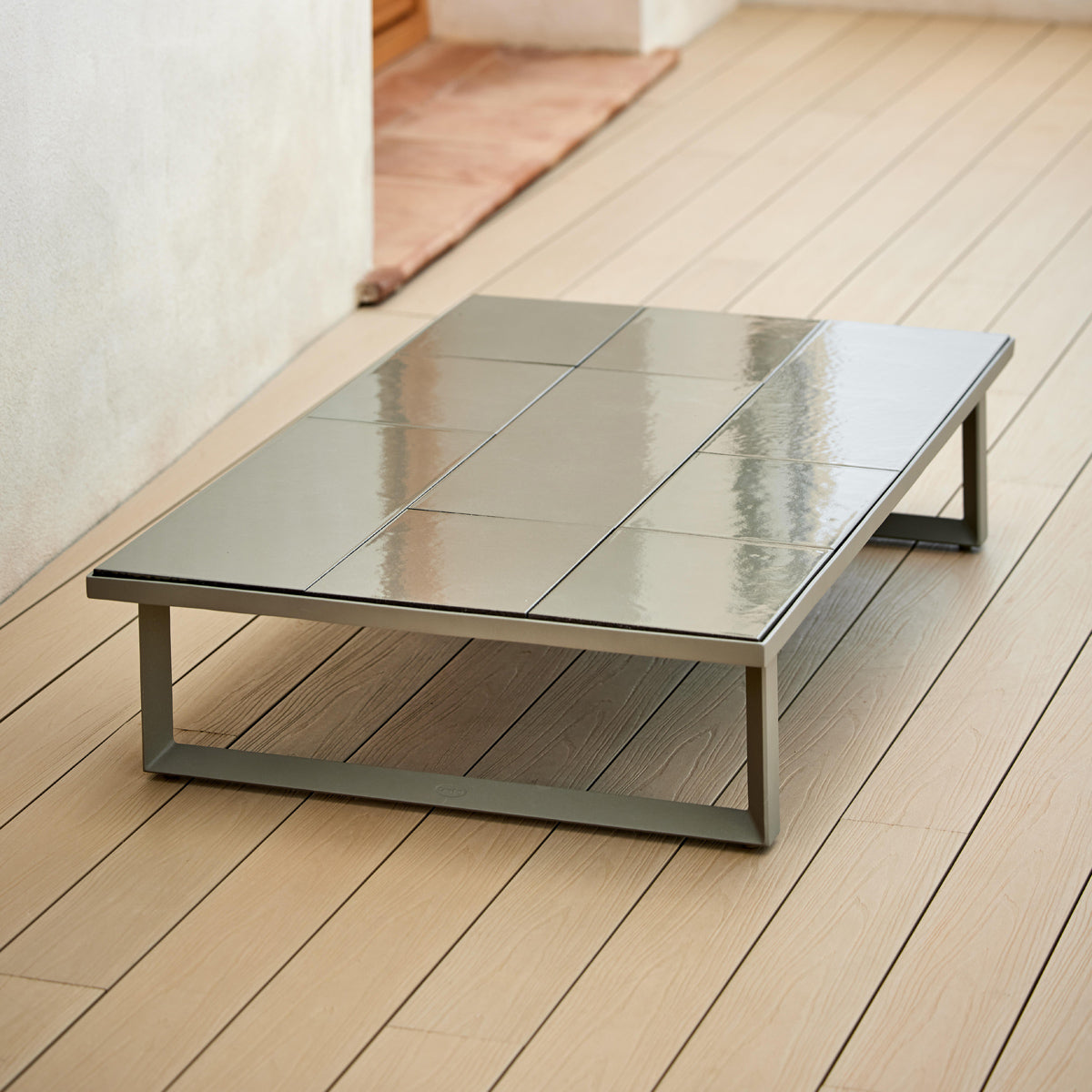 Glaze Coffee Table by Cane-Line, showing glaze coffee table in live shot.