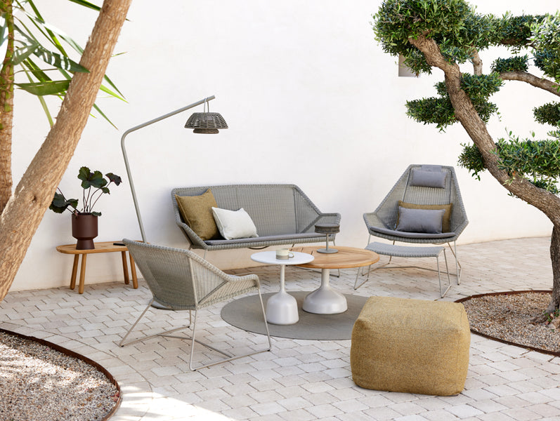 Glaze Coffee Table by Cane-Line, showing glaze coffee tables in live shot.