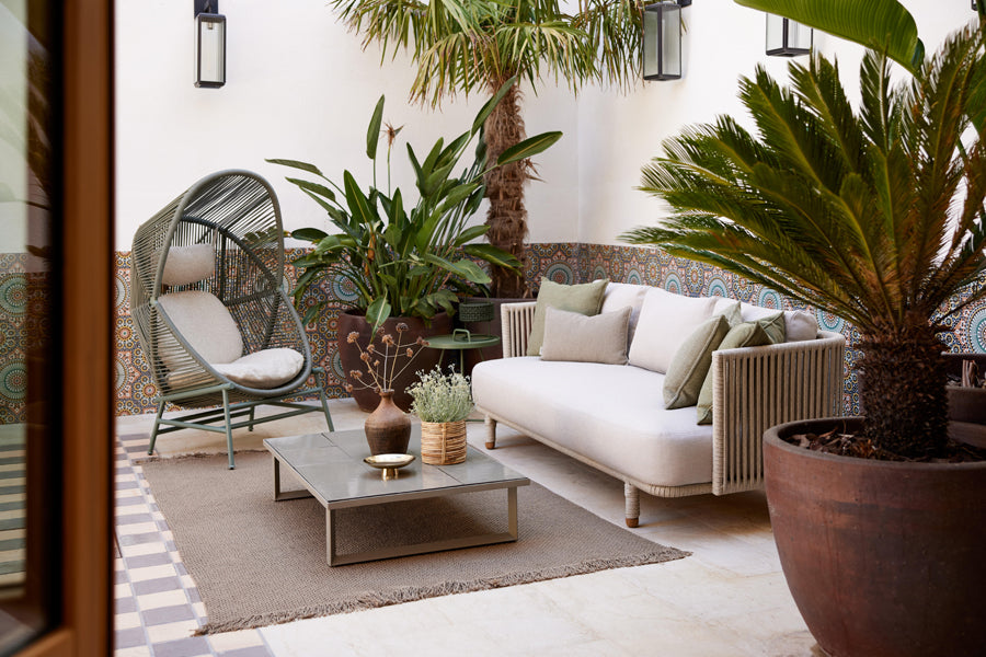 Glaze Coffee Table by Cane-Line, showing glaze coffee table in live shot.