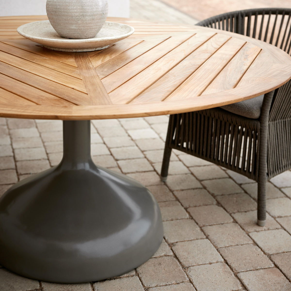 Glaze Dining Table by Cane-Line, showing closeup view of glaze dining table in live shot.