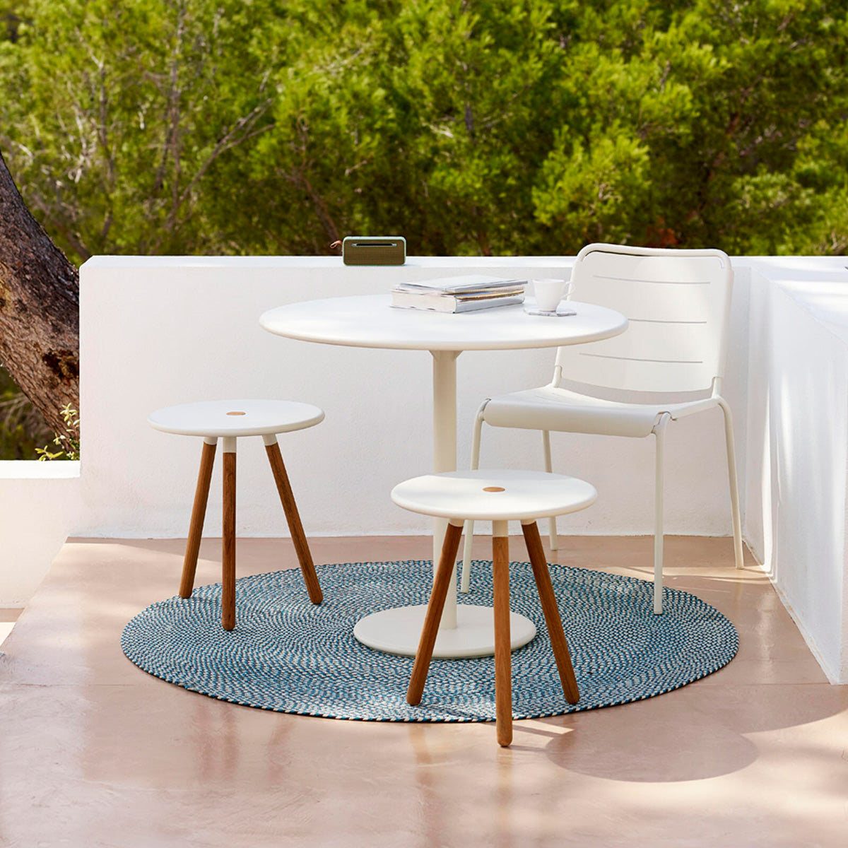 Go 18" Cafe Table by Cane-Line, showing go 18" cafe table in live shot.