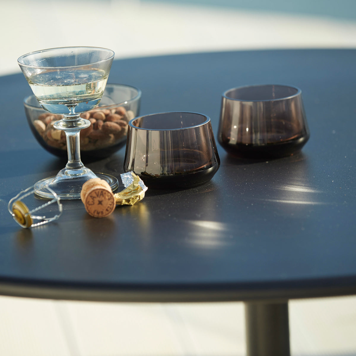 Go 18" Cafe Table by Cane-Line, showing closeup view of go 18" cafe table in live shot.