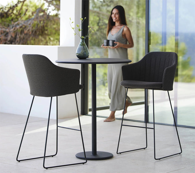 Go 24" Bar Table by Cane-Line, showing go 24" bar table in live shot.