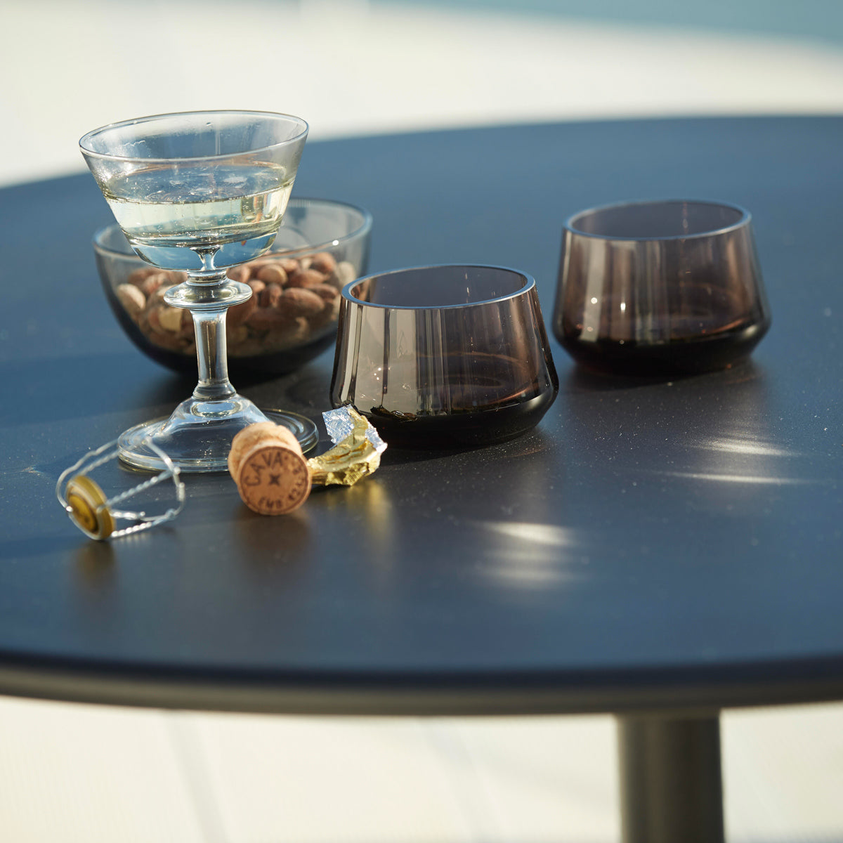 Go 24" Cafe Table by Cane-Line, showing closeup view of go 24" cafe table in live shot.