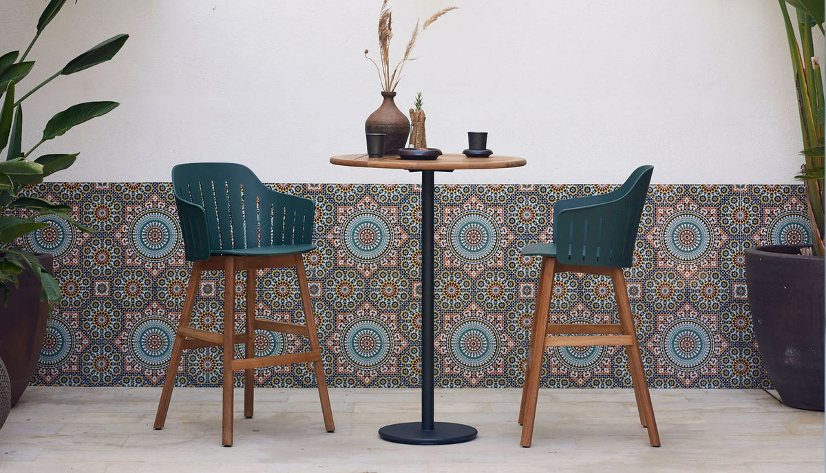 Go 32" Bar Table by Cane-Line, showing go 32" bar table in live shot.