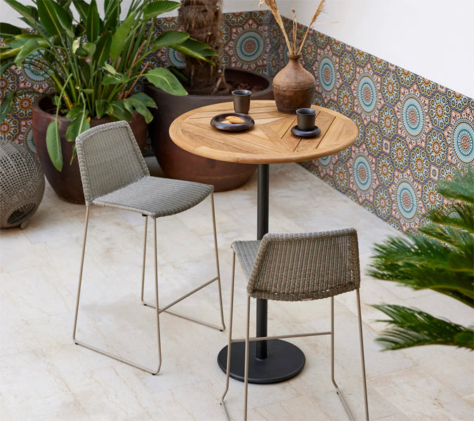 Go 32" Bar Table by Cane-Line, showing go 32" bar table in live shot.