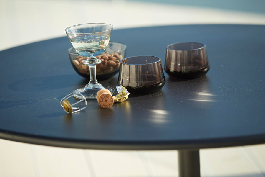 Go 32" Bar Table by Cane-Line, showing closeup view of go 32" bar table in live shot.