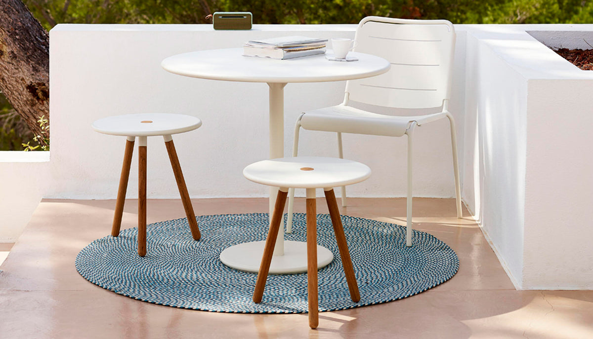 Go 32" Cafe Table by Cane-Line, showing go 32" cafe table in live shot.