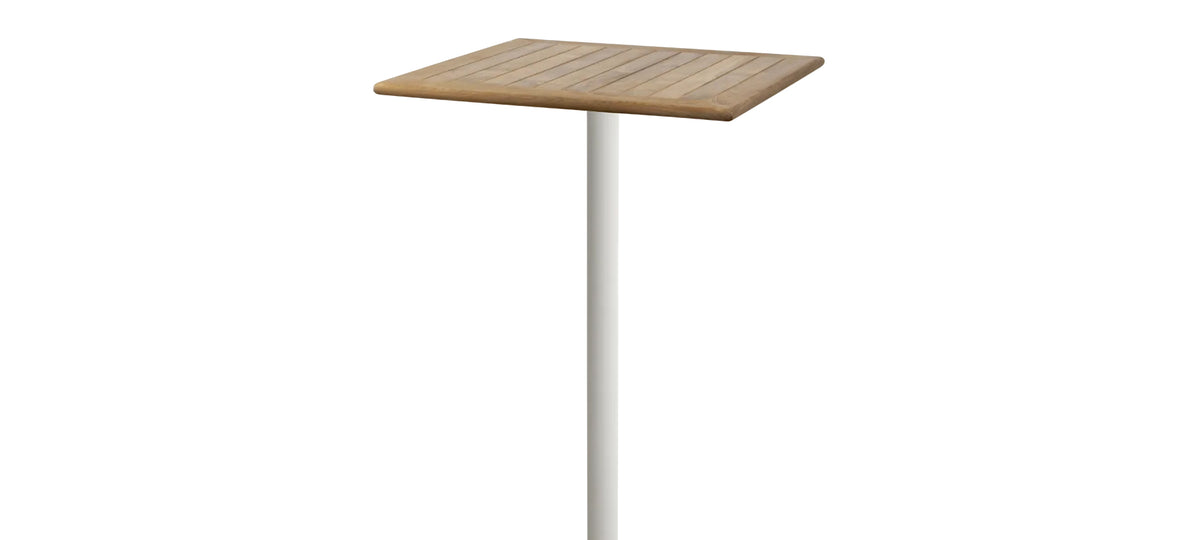Go Square 28.4" Bar Table by Cane-Line, showing closeup view of go square 28.4" bar table in sand aluminum */teak.