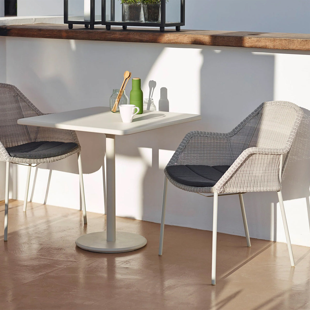 Go Square 30" Cafe Table by Cane-Line, showing go square 30" cafe table in live shot.