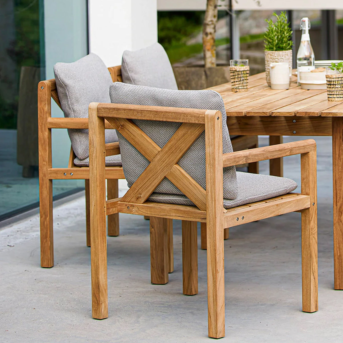 Grace Chair by Cane-Line, showing grace chairs in live shot.