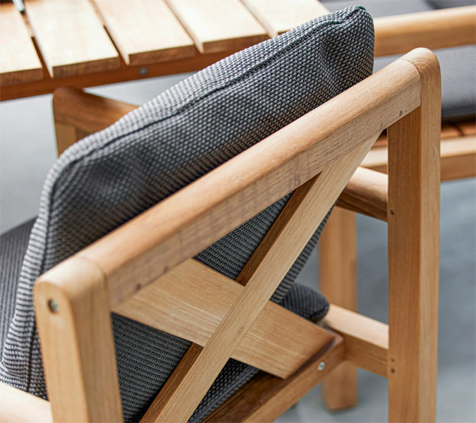 Grace Chair by Cane-Line, showing closeup view of grace chair in live shot.