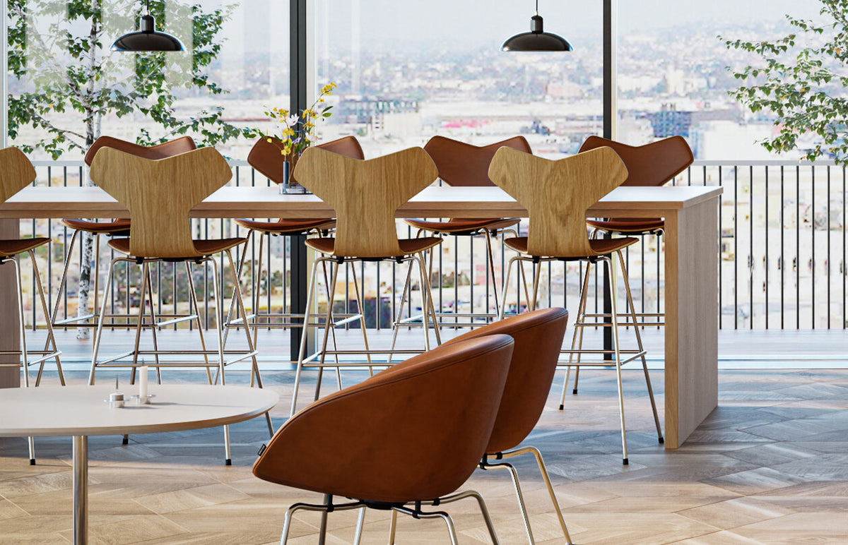 Grand Prix Front Upholstery Counter Stool by Fritz Hansen, showing grand prix front upholstery counter stools in live shot.