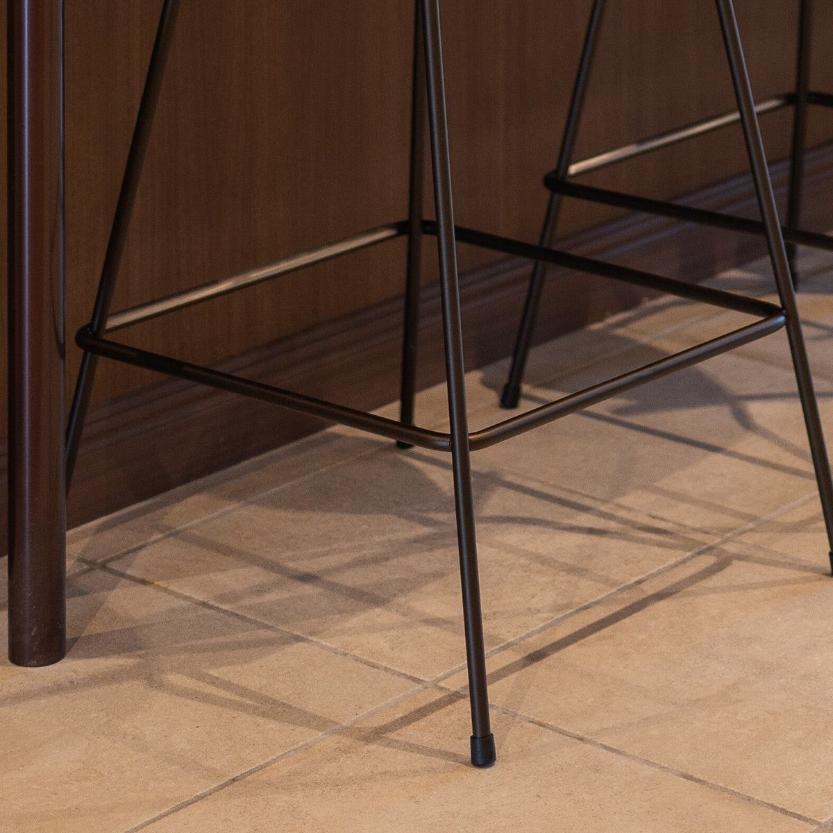 Grand Prix Front Upholstery Counter Stool by Fritz Hansen, showing closeup view of grand prix front upholstery counter stools in live shot.