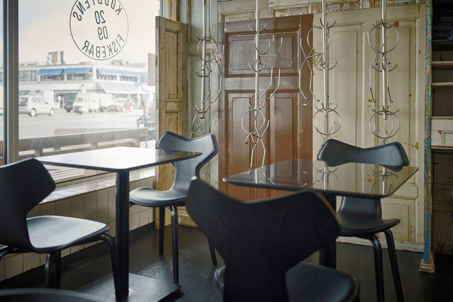 Grand Prix Front Upholstery Wooden Legs Chair by Fritz Hansen, showing grand prix front upholstery wooden legs chairs in live shot.