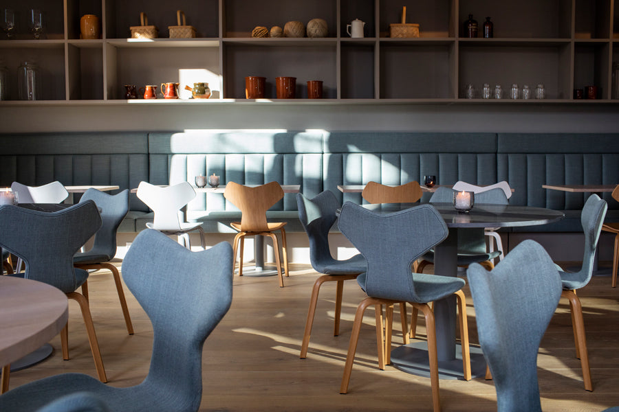 Grand Prix Full Upholstery Wooden Legs Chair by Fritz Hansen, showing grand prix full upholstery wooden legs chairs in live shot.