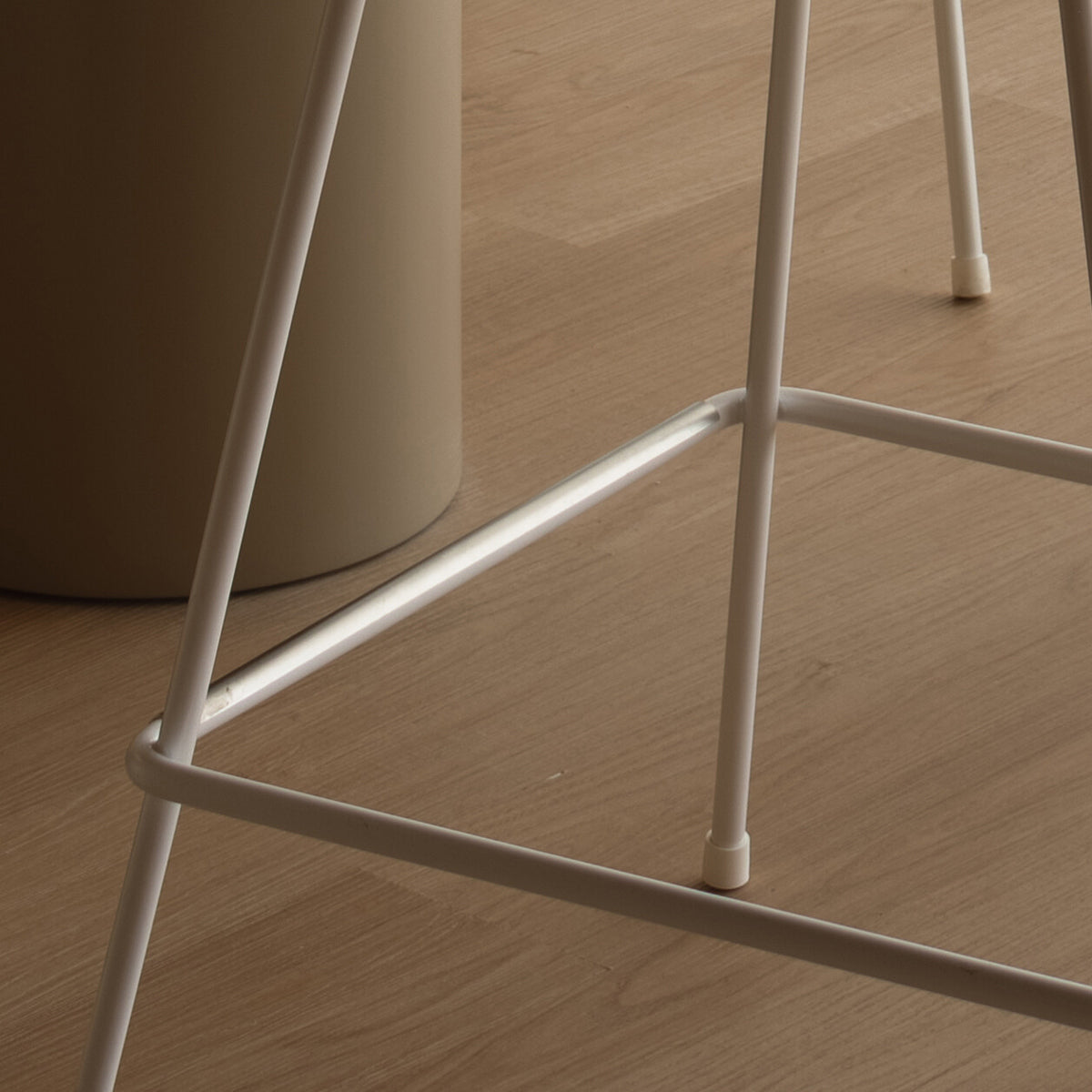 Grand Prix Stool by Fritz Hansen, showing closeup view of grand prix stool in live shot.