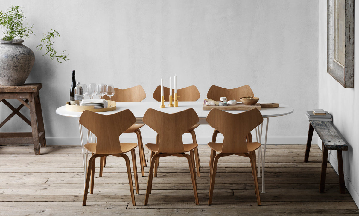 Grand Prix Wooden Legs Chair by Fritz Hansen, showing grand prix wooden legs chairs in live shot.