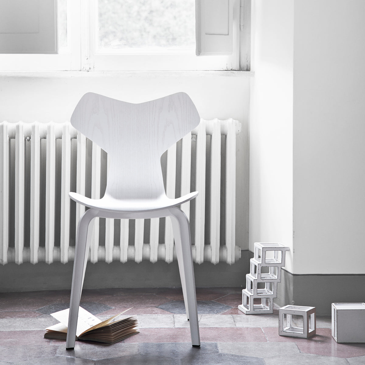 Grand Prix Wooden Legs Chair by Fritz Hansen, showing grand prix wooden legs chairs in live shot.
