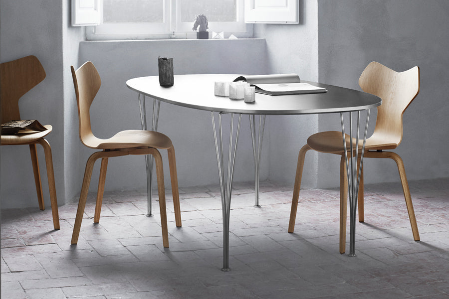 Grand Prix Wooden Legs Chair by Fritz Hansen, showing grand prix wooden legs chairs in live shot.