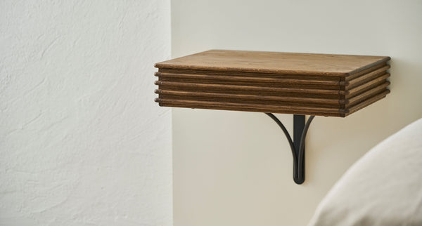 Groove Wall Mounted Night Table by DK3, showing groove wall mounted night table in live shot.