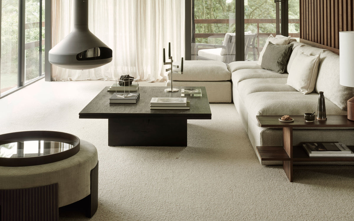 Grooves Coffee Table by Ethnicraft, showing grooves coffee table in live shot.