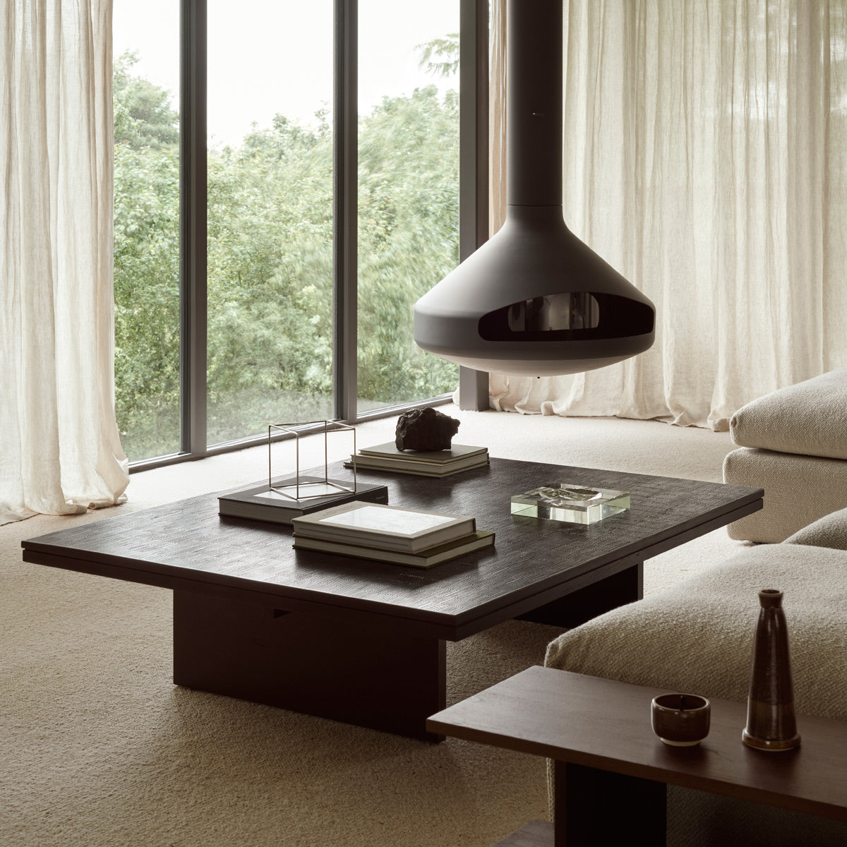 Grooves Coffee Table by Ethnicraft, showing grooves coffee table in live shot.