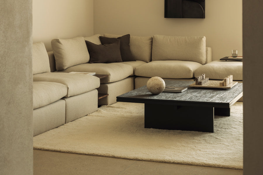 Grooves Coffee Table by Ethnicraft, showing closeup view of grooves coffee table in live shot.