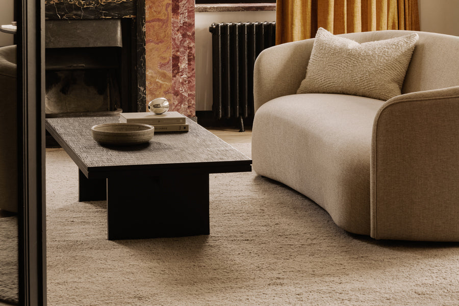 Grooves Coffee Table by Ethnicraft, showing grooves coffee table in live shot.