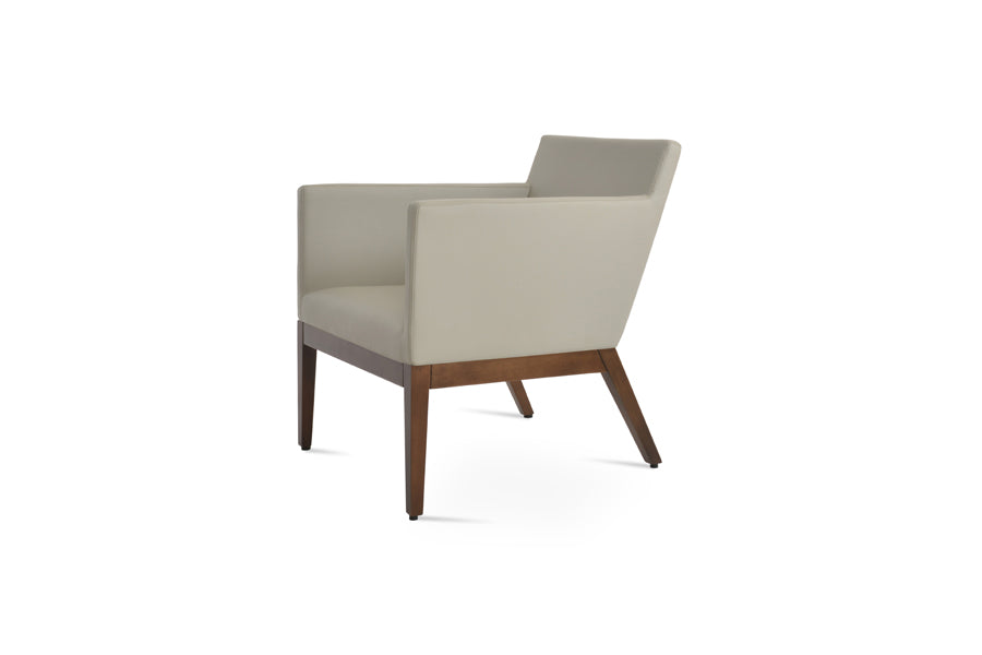 Harput Small Lounge Wood Armchair by SohoConcept, showing side view of harput small lounge wood armchair in light grey leatherette.