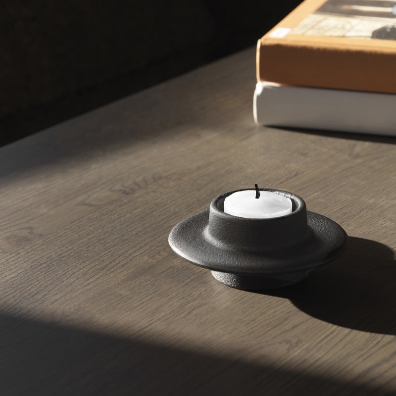 Heima Candle Holder by Normann Copenhagen, showing heima candle holder in live shot.