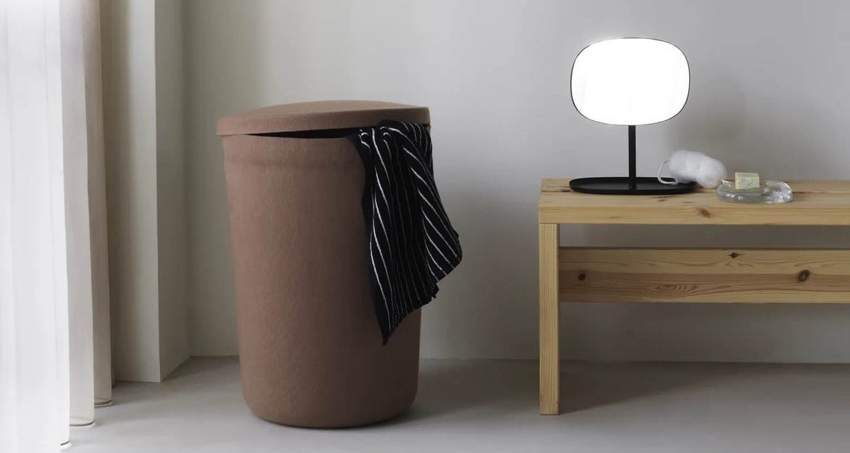 Hide Laundry Basket by Normann Copenhagen, showing hide laundry basket in live shot.