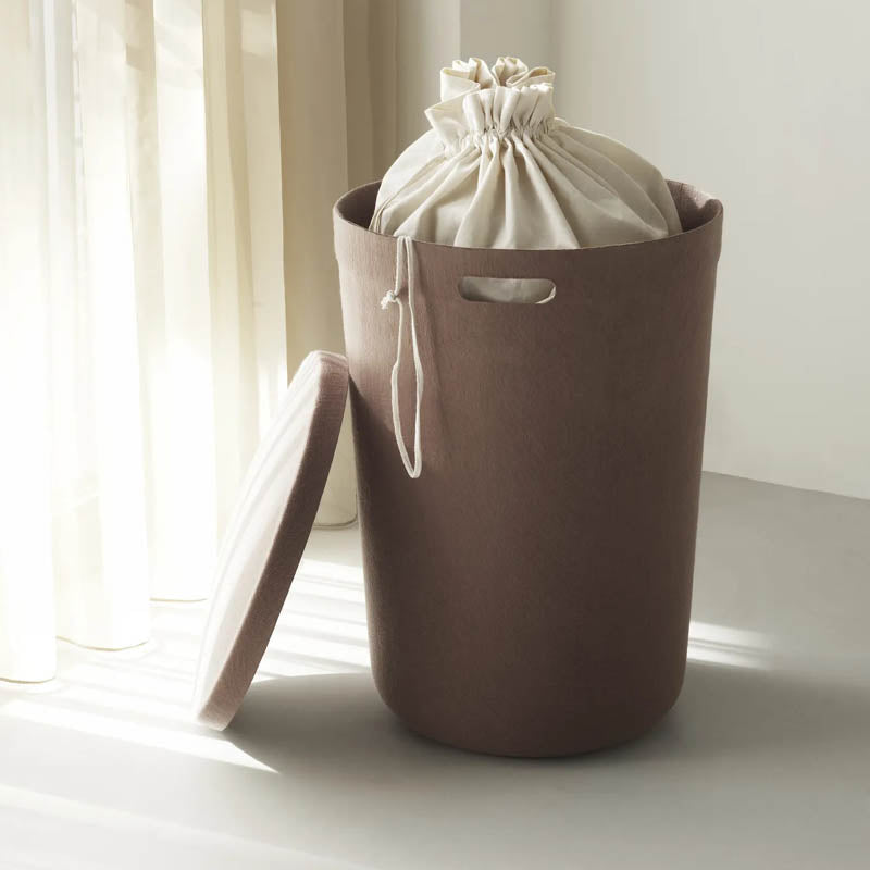 Hide Laundry Basket by Normann Copenhagen, showing hide laundry basket in live shot.