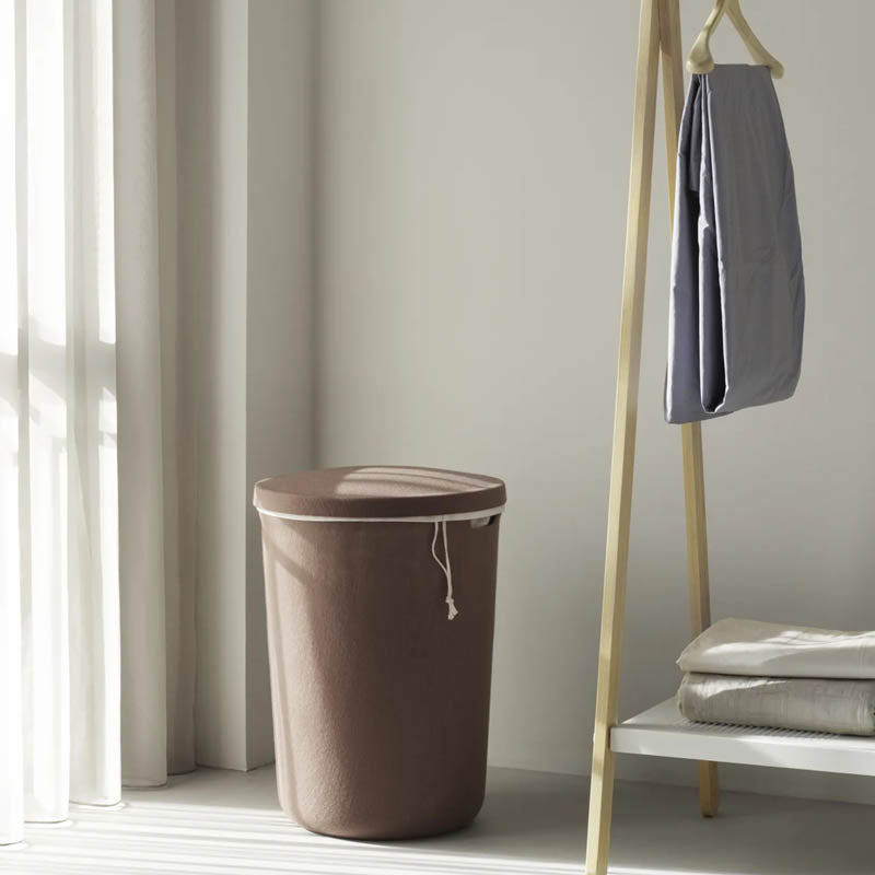 Hide Laundry Basket by Normann Copenhagen, showing hide laundry basket in live shot.