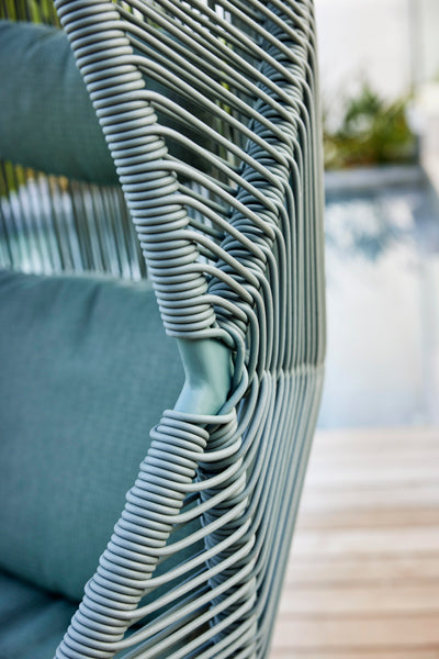 Hive Chair with Base by Cane-Line, showing closeup view of hive chair with base in live shot.