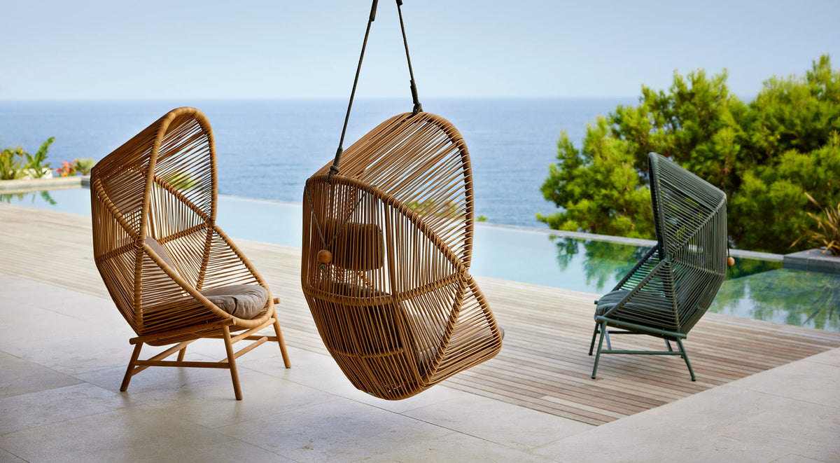 Hive Chair with Base by Cane-Line, showing hive chairs with bases in live shot.